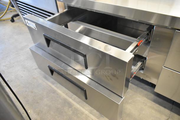 Brand new Avantco 178CBE72HC stainless steel 4-drawer chef base on commercial casters. Shows a few dents. 115V, 1 Phase.