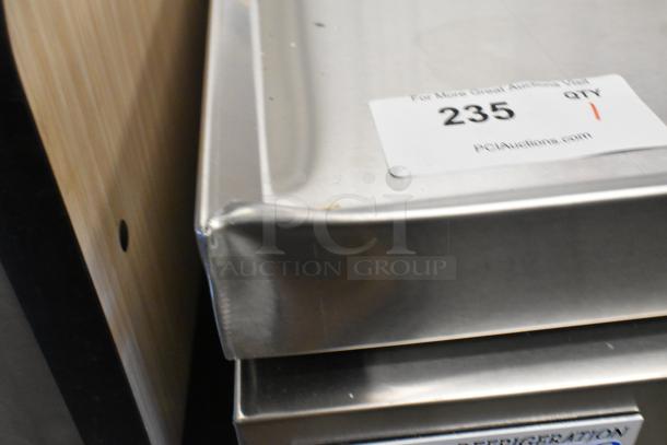 Brand new Avantco 178CBE72HC stainless steel chef base with four drawers, dented corner, commercial casters, 115V, 1 Phase.