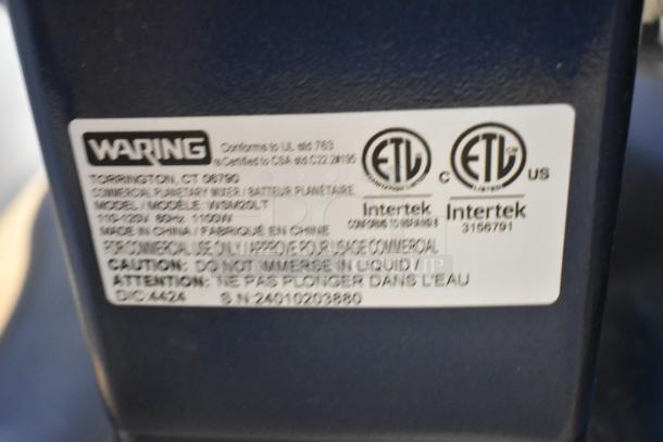alt text: Label on Waring WSM20LT mixer showing model, 120V, 1-phase specs, ETL certifications, and caution against liquid immersion.