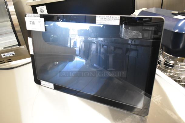 Elo Monitor with a sleek black frame, reflective screen, tags indicating model number, and auction lot number visible.