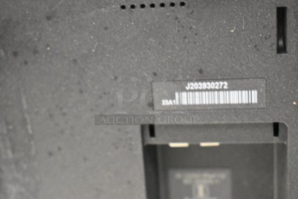 Elo Monitor back panel, featuring barcode label with number J203930272, slight scuffs, and connector port cavity.