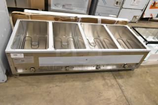 Brand new ServIt 423EST4WO500 stainless steel four-pan steam table with minor scratches. 120V, 1 phase. Labels visible.