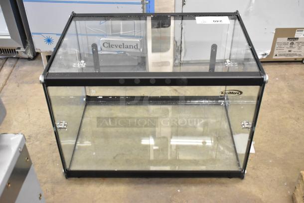 Brand new KoolMore KM-DC-2CSBK countertop dry display case, glass and black frame, slight scratches, labeled KoolMore.