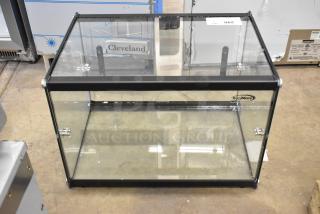 Brand new KoolMore KM-DC-2CSBK countertop dry display case, glass and black frame, slight scratches, labeled KoolMore.