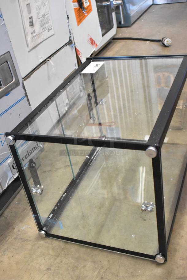 Brand new KoolMore KM-DC-2CSBK countertop display case with minor scratches. Glass panels, metal frame, and label visible.