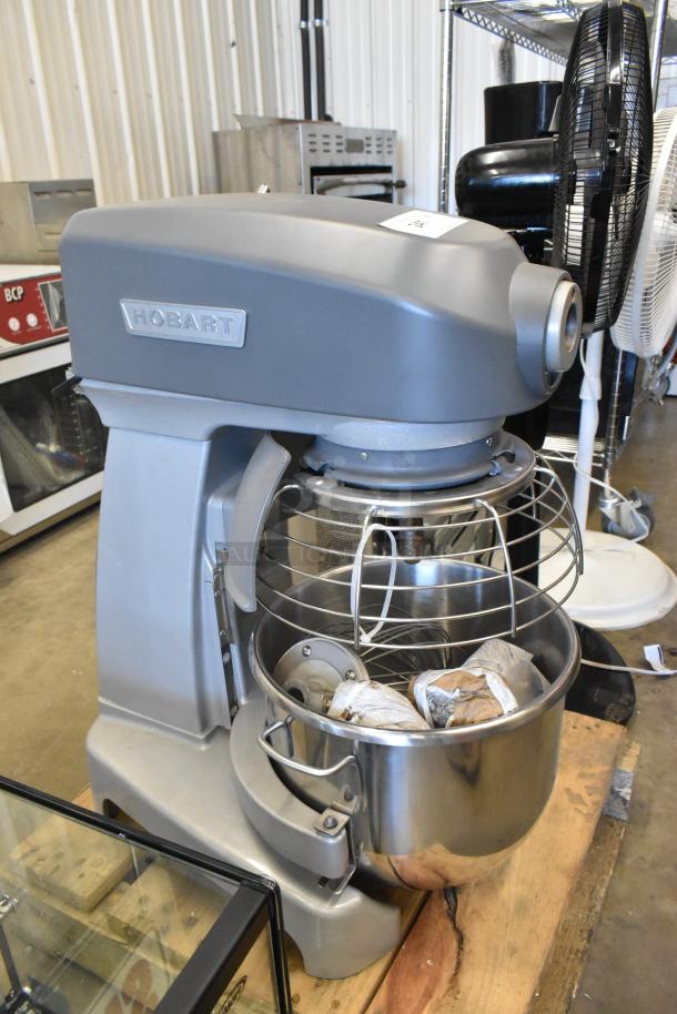 BRAND NEW Hobart Legacy HL200 20 Qt Planetary Dough Mixer with bowl, bowl guard, and whisk. Scratch and dent condition.