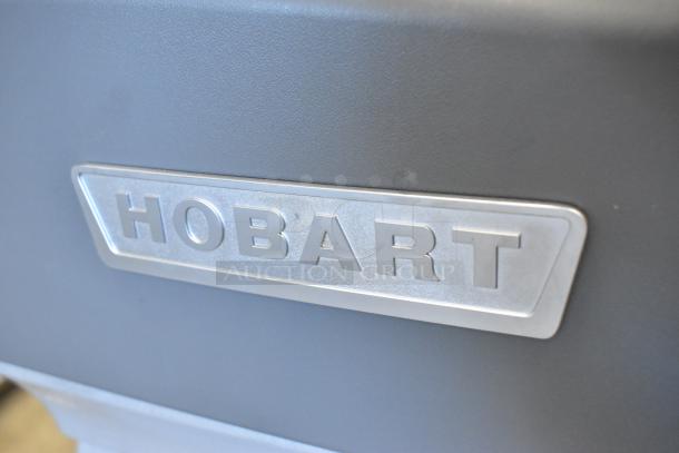 Hobart Legacy HL200 logo emblem on a metal surface, indicating a scratch and dent new 2025 model commercial dough mixer.