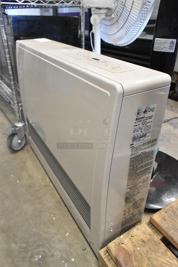 Rinnai EX22CN natural gas direct vent wall furnace, beige color, visible side panel label with instructions.