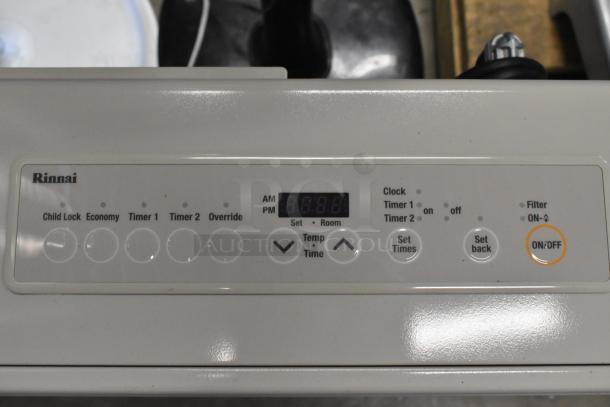 Rinnai EX22CN natural gas wall furnace control panel showing buttons for child lock, economy, timers, and on/off.
