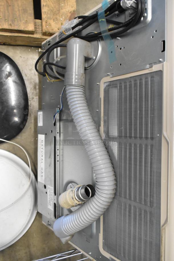 Rinnai EX22CN Natural Gas Direct Vent Wall Furnace, shown with vent tubes and metal casing, in good condition.