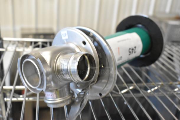 Brand new metal intake unit with minor scratches and dents. Features multiple inlets labeled "TOP" and "OUTLET."