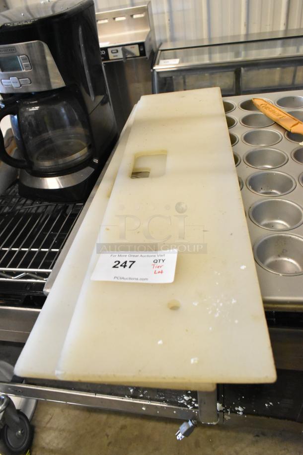 Auction lot with plastic cutting board, stainless steel muffin pan, and poly bins. Includes Black+Decker coffee maker. Moderate wear.
