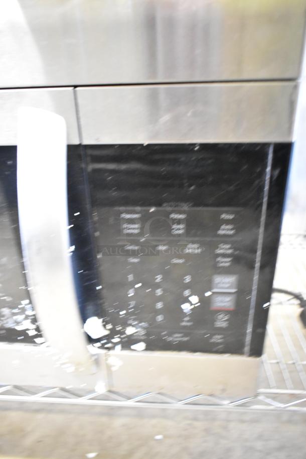 LG LMV1762ST stainless steel microwave with digital controls, visible wear. Includes plate, 120 Volts, 1 Phase.