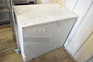 Magic Chef HMCF7W4 Chest Freezer with hinge lid, white, minor wear, label "249" on top, garage storage setting.