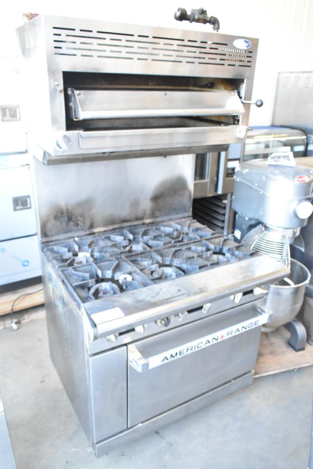 American Range stainless steel 6-burner commercial gas range with oven, salamander cheese melter, and backsplash. Used condition.