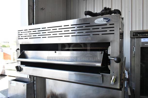 American Range stainless steel salamander cheese melter, part of a commercial 6-burner gas range. Features backsplash and control knobs.
