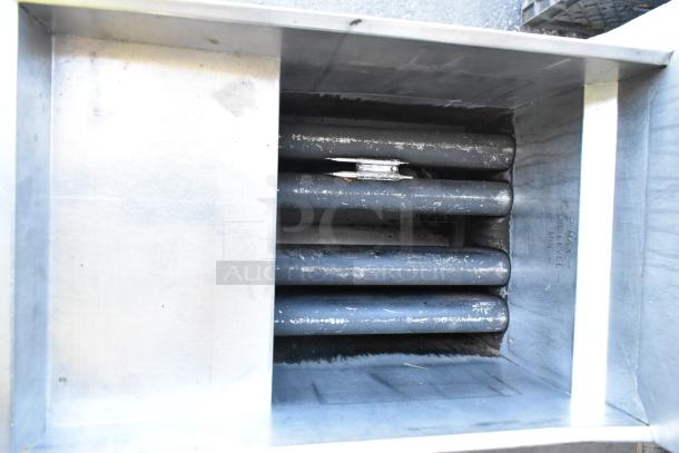 Cecilware stainless steel commercial deep fat fryer, interior view, showing heating elements and oil level markings.