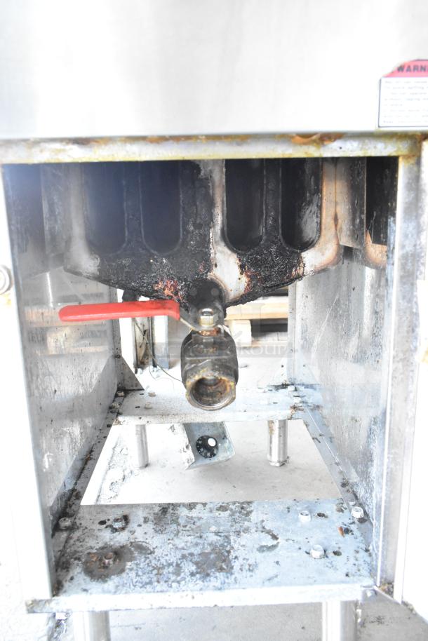 Cecilware stainless steel commercial deep fat fryer in used condition, showing lower section and red lever handle.