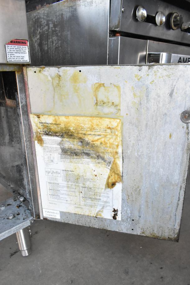 Cecilware stainless steel commercial deep fat fryer with two metal fry baskets. Visible wear and grease stains. Warning and operating instructions attached.