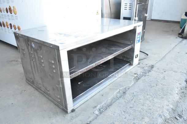 Prince Castle DHB-P1A stainless steel countertop holding bin, 208-240V, 1 phase, visible wear, dual shelves, control panel.