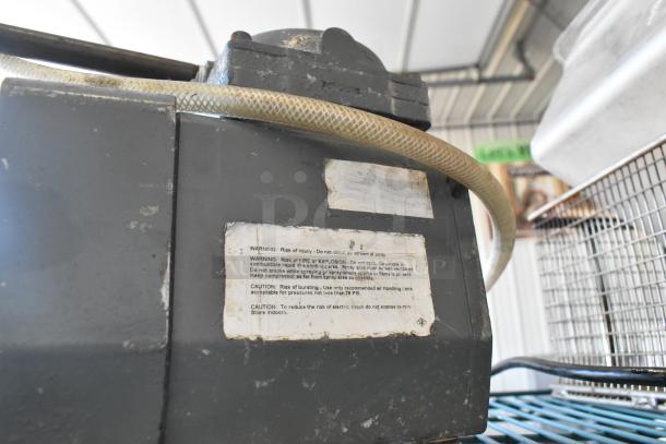 ALL ONE MONEY lot with metal fry basket, poly bin, and motor. Visible wear on motor. Warning label attached.