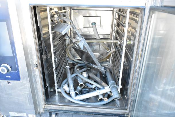 Stainless steel Rational iCombiPro convection oven interior with various metal components inside, 2020 model.