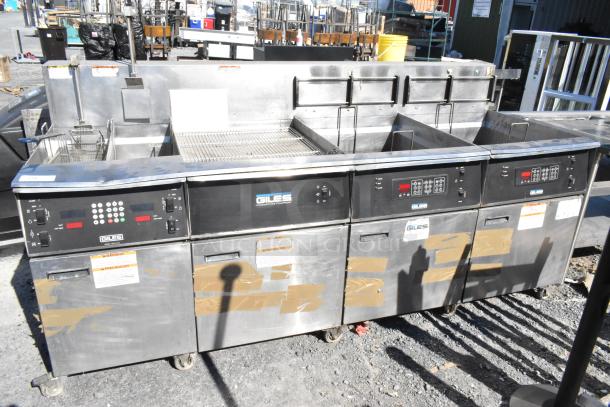 Giles EOF-24 stainless steel 3-bay deep fat fryer with dumping station, commercial casters, 480 volts, used condition.