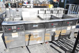 Giles EOF-24 stainless steel 3-bay deep fat fryer with dumping station, commercial casters, 480 volts, used condition.