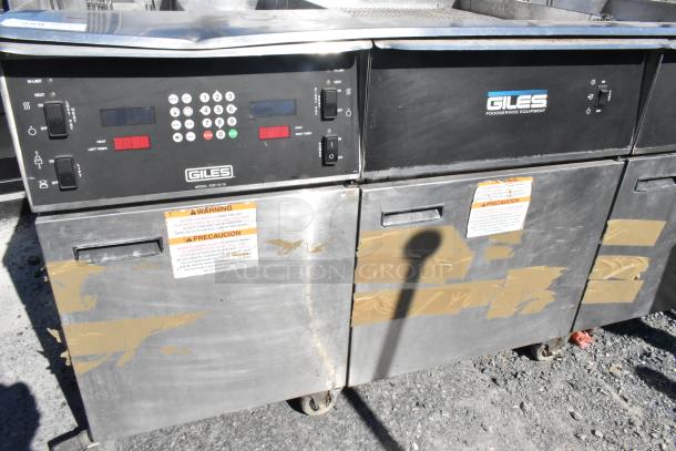 Giles EOF-24 stainless steel 3-bay deep fat fryer with dumping station on casters, 480V, visible wear, warning labels.
