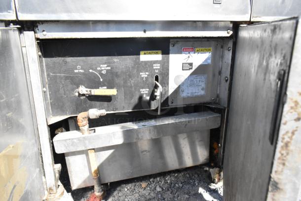 Giles EOF-24 stainless steel commercial 3-bay electric fryer with dumping station, showing control panel and oil system.
