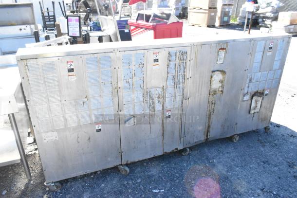 Giles EOF-24 stainless steel 3-bay deep fat fryer with dumping station on casters, showing wear, 480 volts.