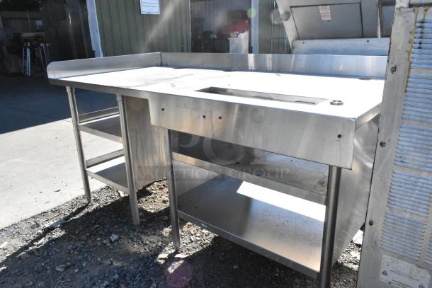 Stainless steel soda station with under shelves, shows light wear and surface marks, ideal for commercial use.