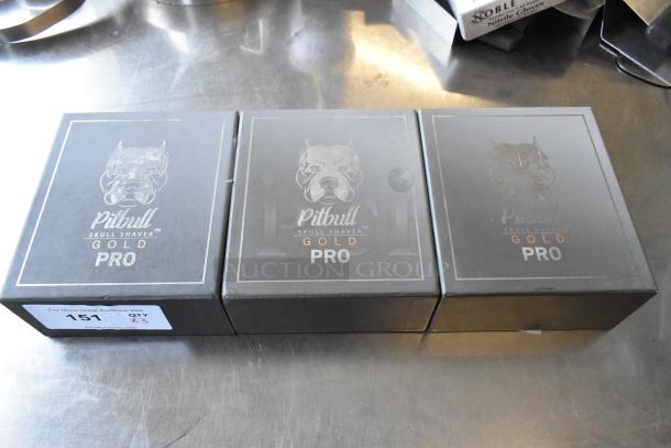 Three brand new Pitbull Gold Pro PBG4-8700 head and face shavers in original packaging.