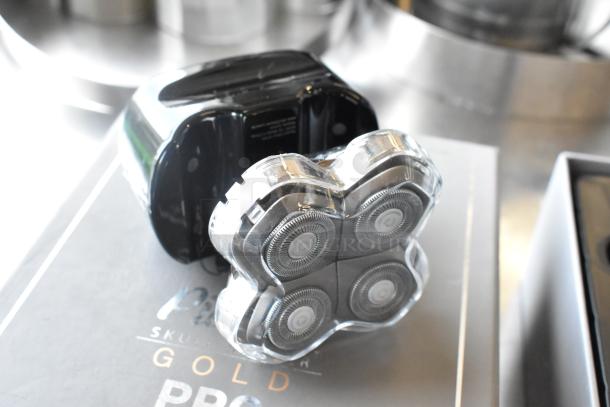 3 brand new Pitbull Gold Pro PBG4-8700 head and face shavers, with multi-blade heads, in packaging.