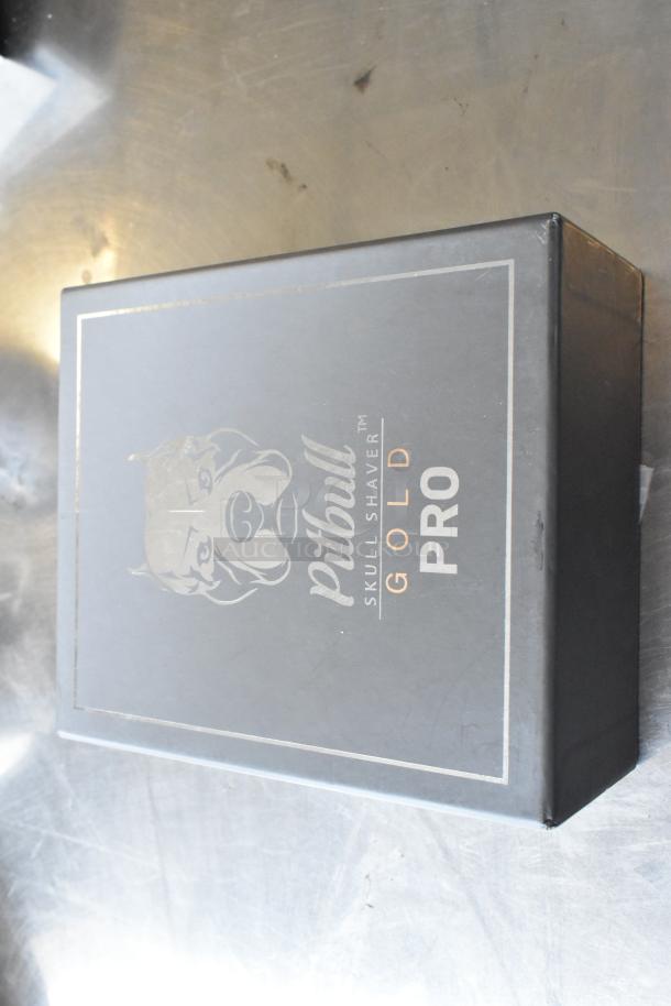 Brand new Pitbull Gold Pro PBG4-8700 Head and Face Shaver in box featuring logo and branding.