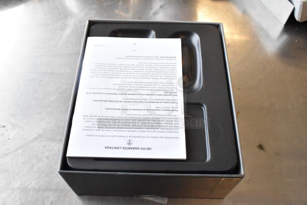 Box containing Pitbull Gold Pro PBG4-8700 Head and Face Shaver, new condition, warranty document visible.
