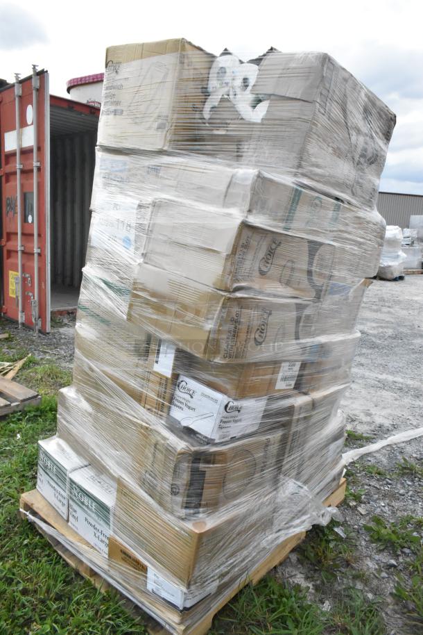 Pallet of 33 assorted scratch and dent items, including paper towels, cold cups, plates, and containers, shrink-wrapped.