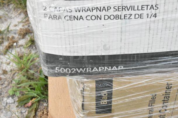 Plastic-wrapped boxes labeled "WRAPNAP napkins," "2 capas," and "5002WRAPNAP." Items appear new, scratch and dent condition.