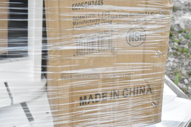 Plastic-wrapped box labeled "Made in China," part of a lot including new scratch and dent items like straws, trays.