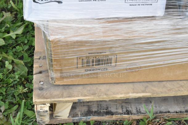 Plastic-wrapped pallet of boxes labeled "Made in Vietnam" and "Made in China," containing scratch and dent items.
