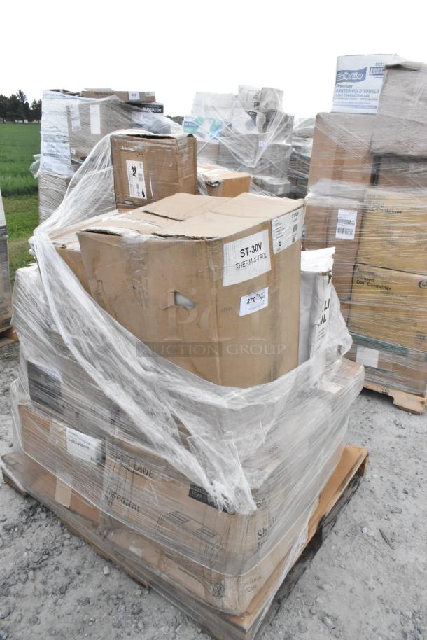 Pallet of 22 scratch and dent items wrapped in plastic, including boxes labeled with various hardware and home goods.
