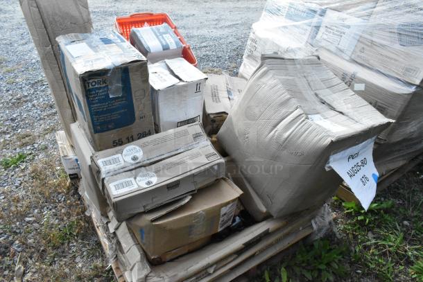 Pallet of 16 boxes labeled "Scratch and Dent" with various new items like food processor blades, floor mat, and more.