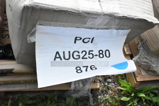 Cardboard box with visible label reading "PCI AUG25-80 876," containing scratch and dent items like food processor blades and floor mat.