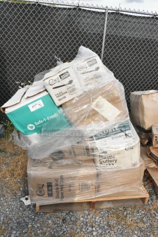 Pallet with wrapped boxes of brand new scratch and dent items including hot cups, containers, and spoons. Visible labels: Choice, Noble, Safe-T-Fresh.