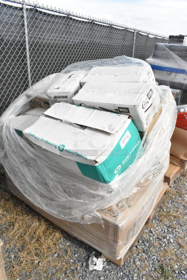 Pallet with 16 new scratch and dent items, including hot cups, containers, and spoons, wrapped in plastic.