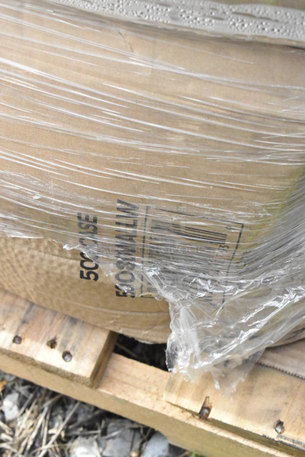 Plastic-wrapped pallet of brand new scratch and dent items including hot cups, containers, and spoons, marked "500 CASE."