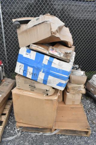 Eight boxes of scratch and dent items including Choice 3-tier stand and Baker's Mark pan, stacked on a pallet.