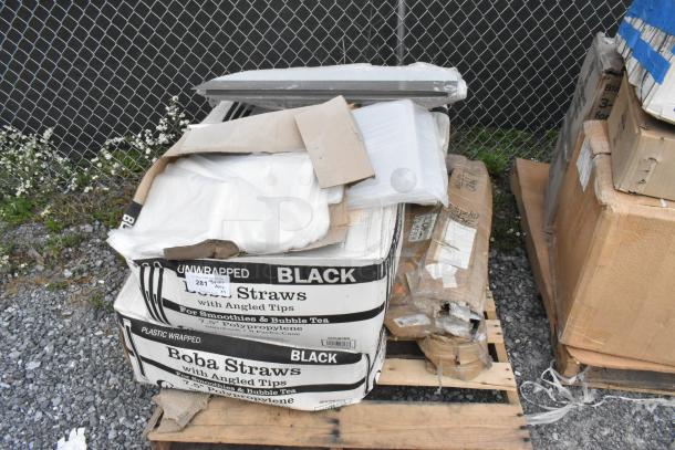 Boxes of 485UB7BK black smoothie straws and Scott toilet paper dispenser, new condition, on a pallet.