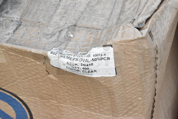 Cardboard box with a label indicating "Palmer's Oval, 50% PCR, QTY: 400, Color: Clear." The box shows signs of wear.