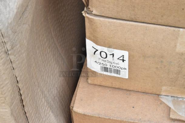 Cardboard box labeled "7014 Hot Dog Kraft, 7 Inch, 4/250 1000pk," among auction items with minor scratches and dents.